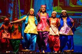 Energetic Bhangra group performance with coordinated movements